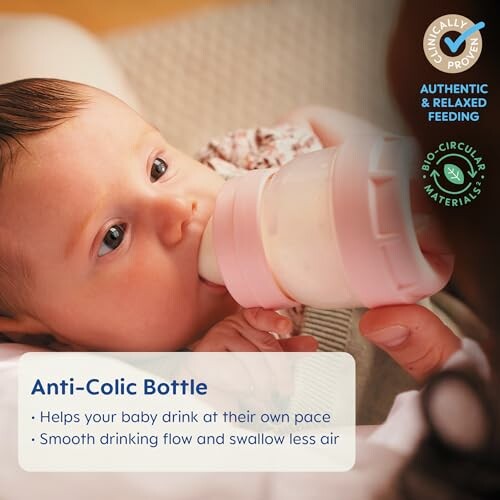 Baby drinking from an anti-colic bottle.